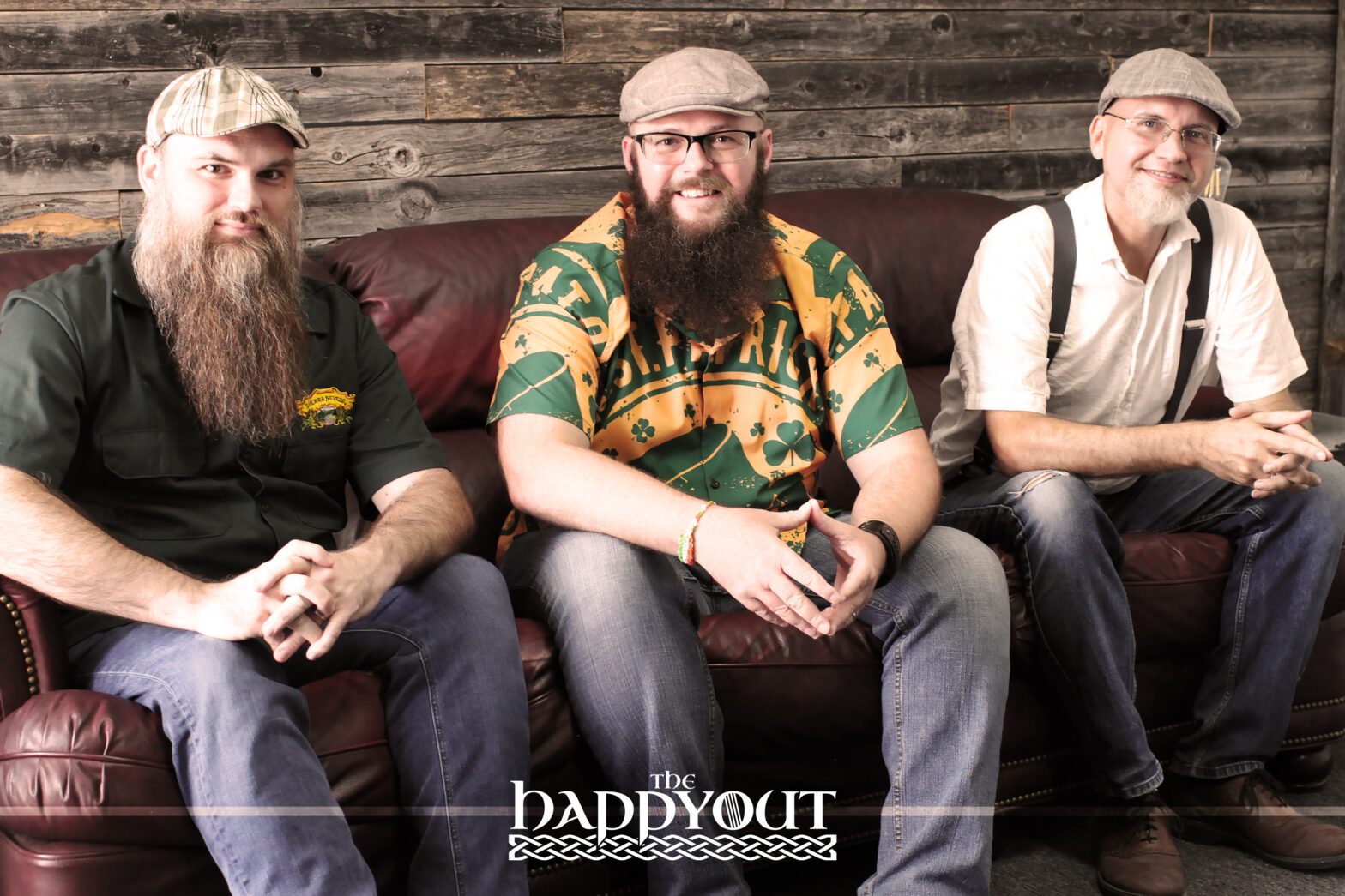 The Happy Out Band Sitting on Couch with Logo